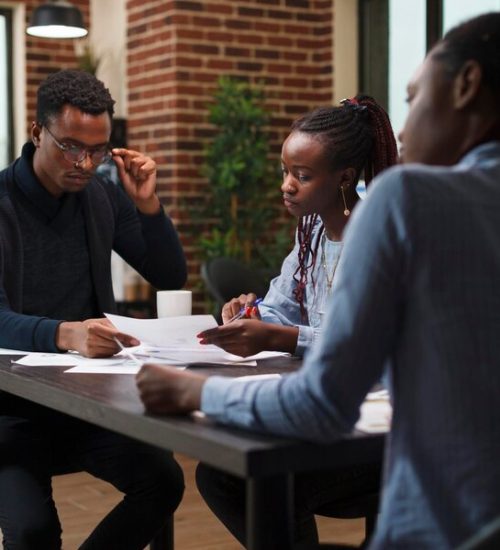 african-american-research-agency-coworkers-meeting-about-startup-project-financial-status-business-people-desk-company-office-finance-department-talking-about-marketing-expenses_482257-40197